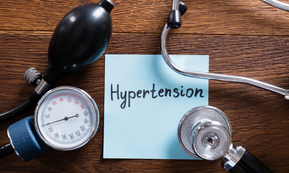 Doctor reviewing elevated morning blood pressure readings with patient