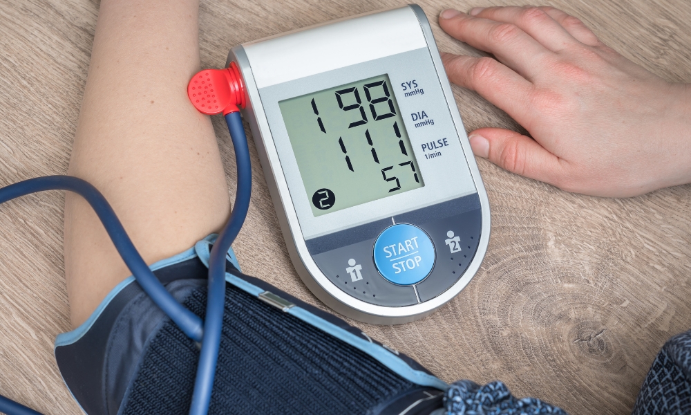 Adult checking blood pressure at home shortly after waking up