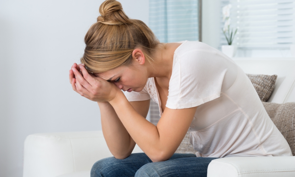 Person experiencing anxiety symptoms with elevated heart rate and blood pressure changes